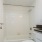 a bathroom with a shower unit and toilet