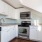 a kitchen with white cabinets