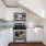 a kitchen with white cabinets