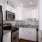 a kitchen with white cabinets