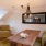 a living room with a table and chairs